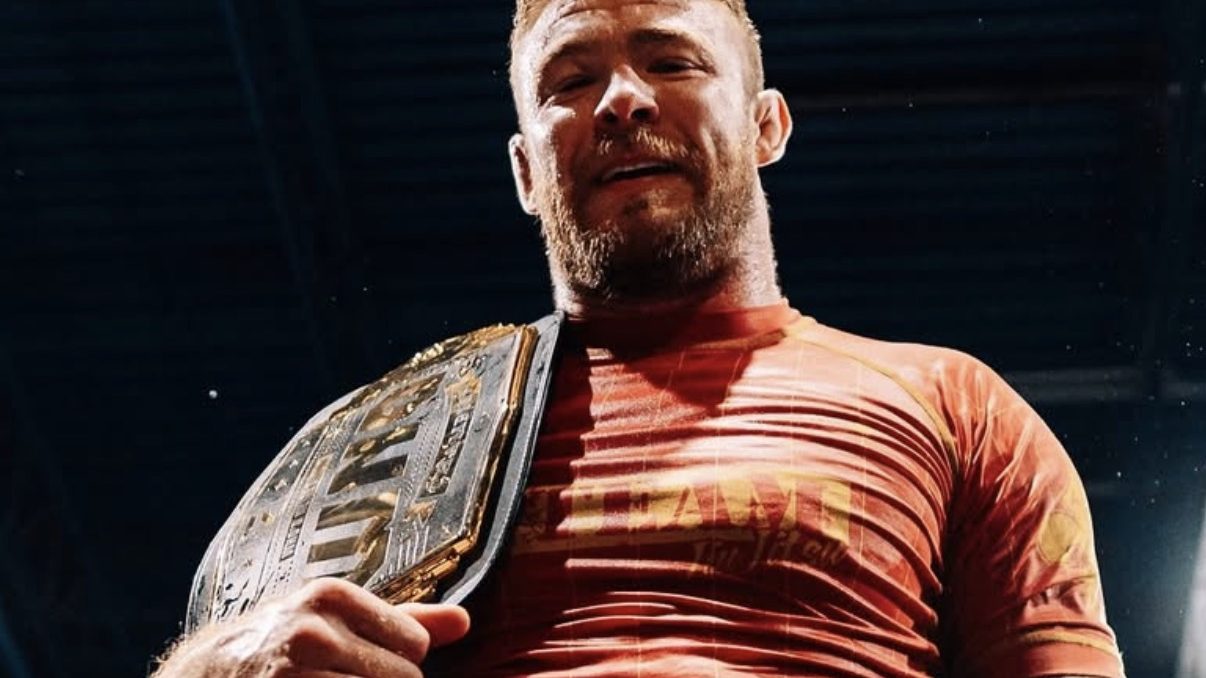 Declan Moody with a championship belt over his shoulder