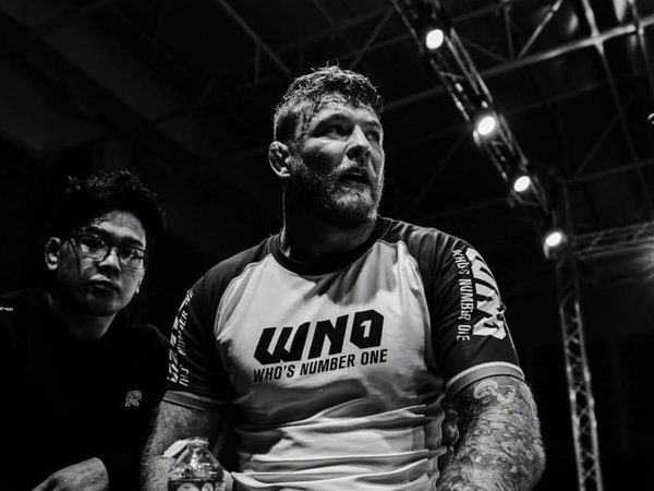 Declan Moody catching his breath after a match at WNO, water bottle in hand