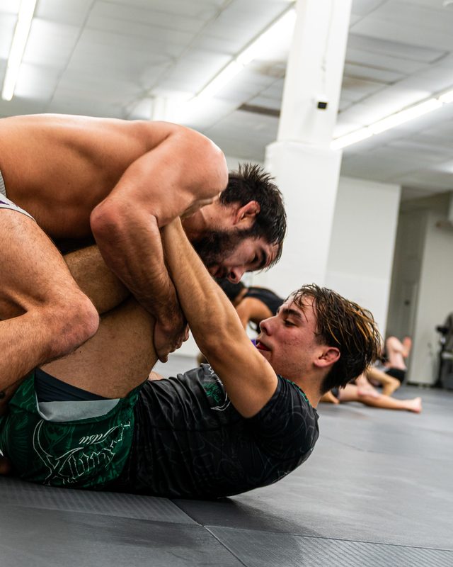 Frankie Lopez training no-gi on the mats with a partner